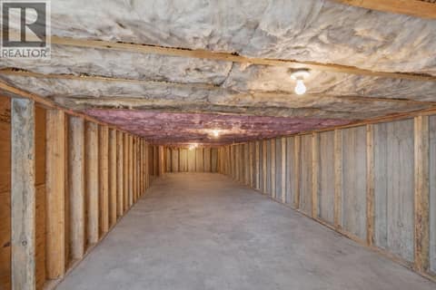 925 sqft unfinished storage area. AI used in photo at 1086 Aurora Heights, West Kelowna Estates