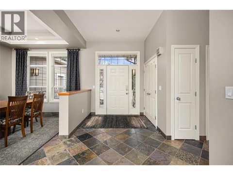 10-foot high ceilings, large foyer with coat closet and storage. at 10726 Nighthawk Road Unit# 60, Lake Country North West
