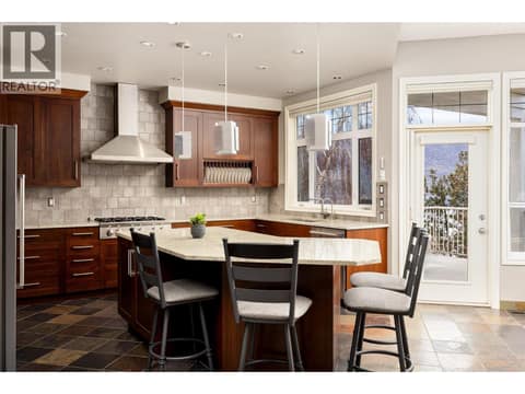 Ample counter space for preparing meals, large island great for entertaining. at 10726 Nighthawk Road Unit# 60, Lake Country North West