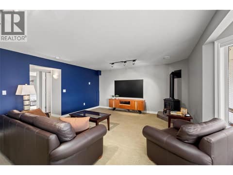 Gas fireplace, TV area. at 10726 Nighthawk Road Unit# 60, Lake Country North West