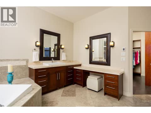 Heated floors, travertine counters, dual sinks with vanity space. at 10726 Nighthawk Road Unit# 60, Lake Country North West