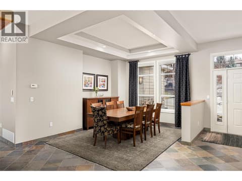 Large dining room with tray ceiling. at 10726 Nighthawk Road Unit# 60, Lake Country North West
