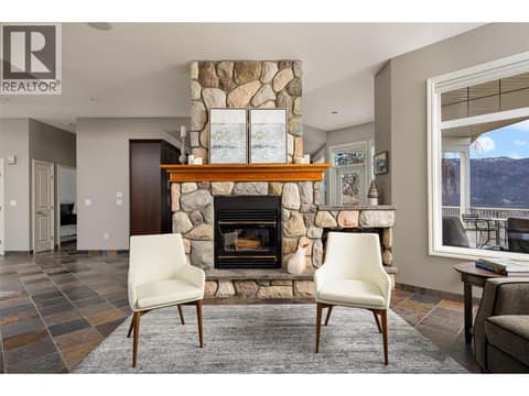 Two-way wood-burning fireplace. at 10726 Nighthawk Road Unit# 60, Lake Country North West