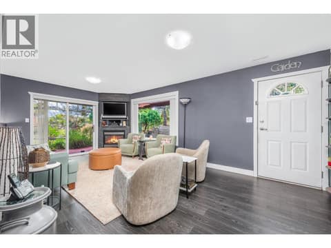 Lower level family room with walk out straight to private back yard and hot tub area at 6901 Manning Place Unit# 3, Foothills, Vernon