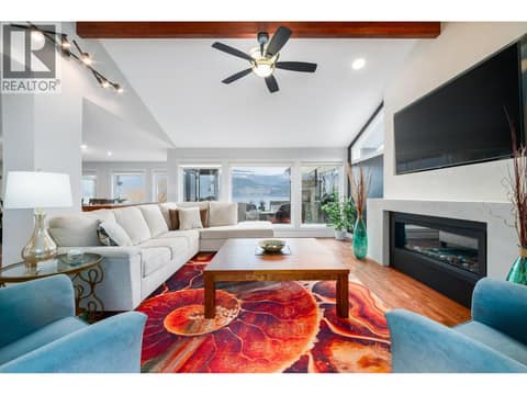 Living room w/vaulted & exposed beam ceiling at 955 Gable Road, Lake Country North West