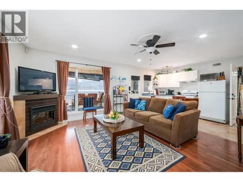 Living room w/new electric fireplace in the suite - main floor of main house at 955 Gable Road, Lake Country North West