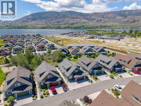 Aerial view front of house looking southwest at 2450 Radio Tower Road Unit# 38, Oliver Rural