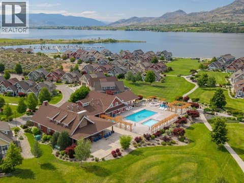 Aerial view of clubhouse and lake at 2450 Radio Tower Road Unit# 38, Oliver Rural