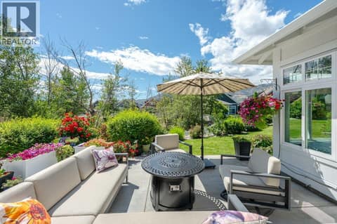 Back patio with plumbed in fire table at 2450 Radio Tower Road Unit# 38, Oliver Rural