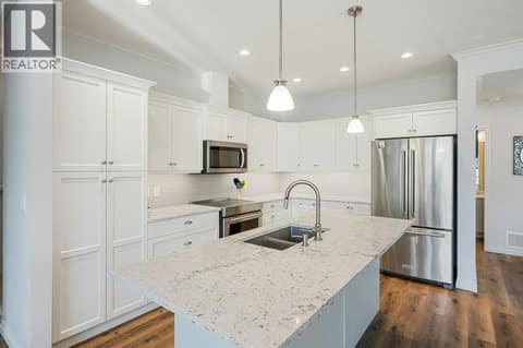 Kitchen with quartz counters & pantry at 2450 Radio Tower Road Unit# 38, Oliver Rural