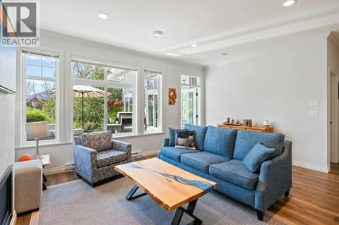 Living room looking through to patio at 2450 Radio Tower Road Unit# 38, Oliver Rural