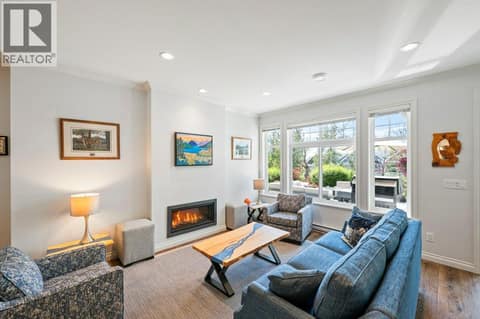 Living room with propane fireplace at 2450 Radio Tower Road Unit# 38, Oliver Rural