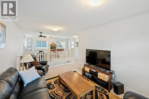 Upper level family room looking towards den/office at 2450 Radio Tower Road Unit# 38, Oliver Rural