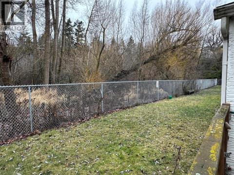 Green space with the creek in the background at 2310 36 Street Unit# 14, City of Vernon