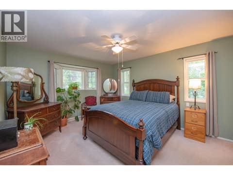 Large Master Bedroom on the main floor at 33 Birch Road, Lumby Valley