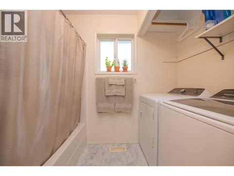 Laundry in the main floor bathroom at 33 Birch Road, Lumby Valley