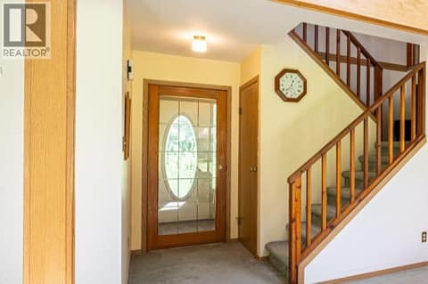 Main Floor Level: The Glass Door = Front Entrance at 187 Gibson Road, Lumby Valley