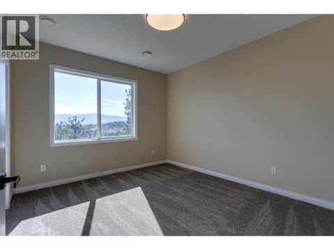 Bedroom down at 1084 Aurora Heights, West Kelowna Estates