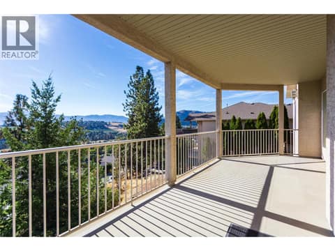 Covered deck off rec room at 1084 Aurora Heights, West Kelowna Estates