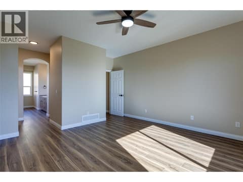 Primary bedroom at 1084 Aurora Heights, West Kelowna Estates