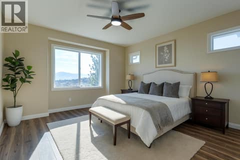 Primary bedroom virtually staged at 1084 Aurora Heights, West Kelowna Estates