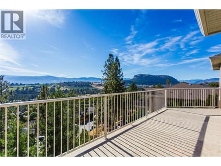 Upper patio with amazing lake and city views at 1084 Aurora Heights, West Kelowna Estates