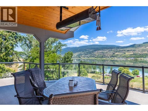 Covered front deck with gas heater at 6902 Old Kamloops Road, Swan Lake West, Vernon