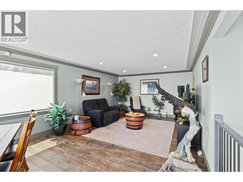 Gas fireplace in the livingroom upstairs at 6902 Old Kamloops Road, Swan Lake West, Vernon