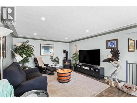 Gas fireplace in the livingroom upstairs at 6902 Old Kamloops Road, Swan Lake West, Vernon