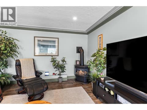 Gas fireplace in the livingroom upstairs at 6902 Old Kamloops Road, Swan Lake West, Vernon