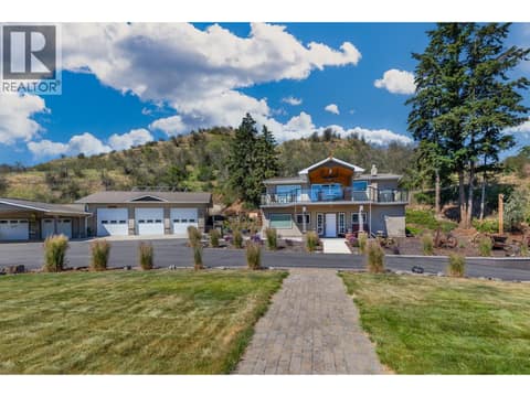 Landscaped around the home & sloped topography behind with hiking trail at 6902 Old Kamloops Road, Swan Lake West, Vernon