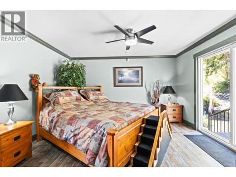 Primary bedroom upstairs at 6902 Old Kamloops Road, Swan Lake West, Vernon