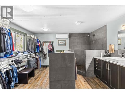 Primary ensuite with custom tile shower at 6902 Old Kamloops Road, Swan Lake West, Vernon