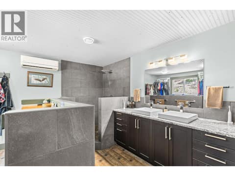 Primary ensuite with custom tile shower at 6902 Old Kamloops Road, Swan Lake West, Vernon