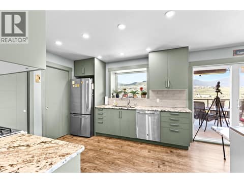 Take in the view from your updated kitchen at 6902 Old Kamloops Road, Swan Lake West, Vernon