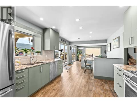 Take in the view from your updated kitchen at 6902 Old Kamloops Road, Swan Lake West, Vernon