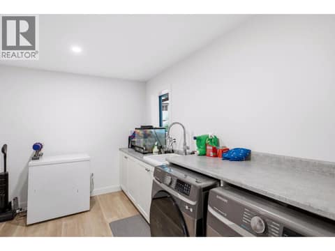 Large laundry/storage room with window - multifunctional at 16515 Commonage Road, Lake Country North West