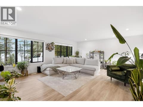 Large windows with lake views & open floor plan rancher at 16515 Commonage Road, Lake Country North West