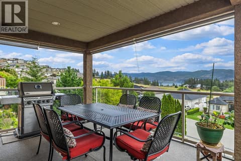 Main floor covered portion of patio with views at 3069 Bridlehill Drive, Smith Creek, West Kelowna