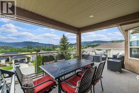 Main floor covered portion of patio with views at 3069 Bridlehill Drive, Smith Creek, West Kelowna