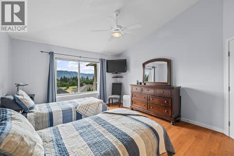 Main floor primary bedroom at 3069 Bridlehill Drive, Smith Creek, West Kelowna