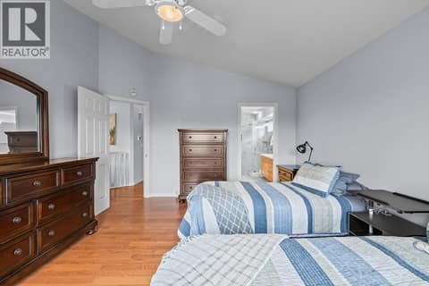 Main floor primary bedroom at 3069 Bridlehill Drive, Smith Creek, West Kelowna