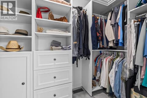 Primary walk-in closet with built-ins at 3069 Bridlehill Drive, Smith Creek, West Kelowna