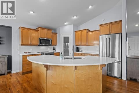 Spacious kitchen with large island at 3069 Bridlehill Drive, Smith Creek, West Kelowna