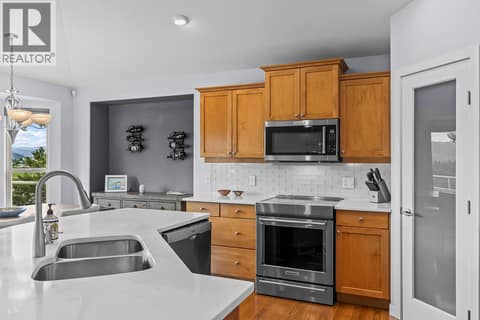 Spacious kitchen with large island at 3069 Bridlehill Drive, Smith Creek, West Kelowna