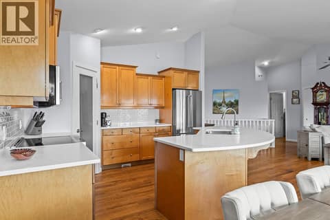 Spacious kitchen with large island at 3069 Bridlehill Drive, Smith Creek, West Kelowna
