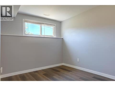 Front bedroom in basement suite. at 4109 24 Avenue, South Vernon
