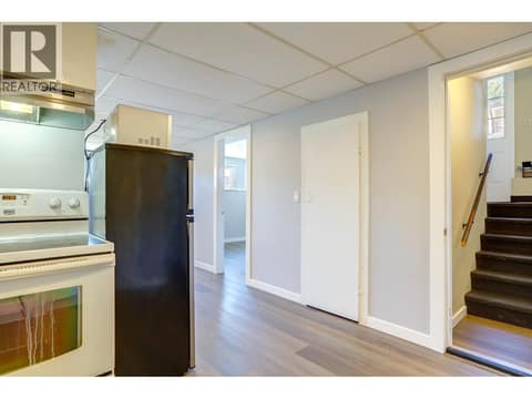 Kitchen towards entry from stairs. at 4109 24 Avenue, South Vernon