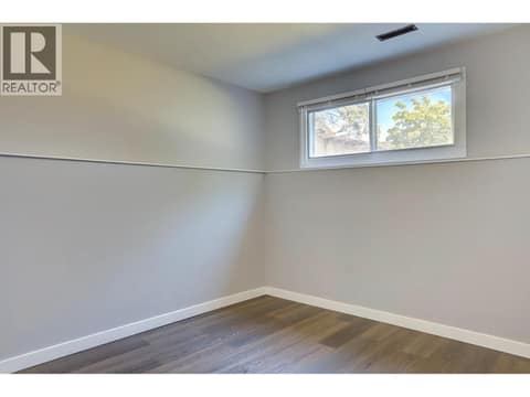 Second bedroom in basement suite towards back yard. at 4109 24 Avenue, South Vernon