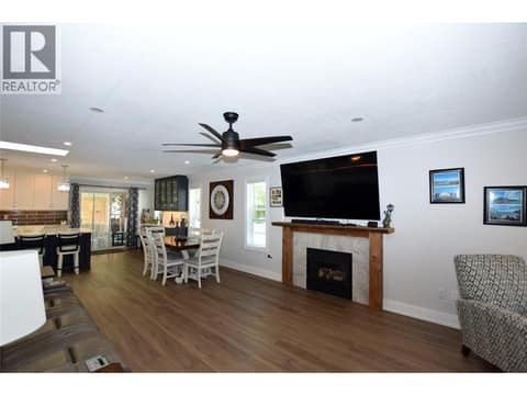 Gas (propane) fireplace in the living room at 562 Meadowlark Avenue, Okanagan North, Vernon
